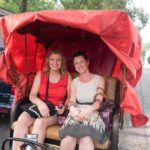 The author Diane, and sister Julie, in the cycle rickshaw on tour in Hutong Village.