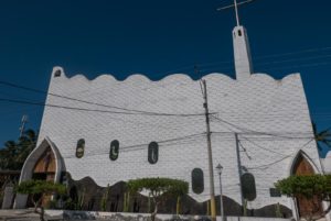 The unusual and very white exterior of the Catholic Church in Puerto Villamil. It's designed to look like waves.