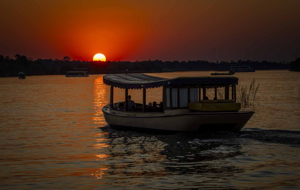The sun sets over the Zambezi River in Livingstone, Zambia